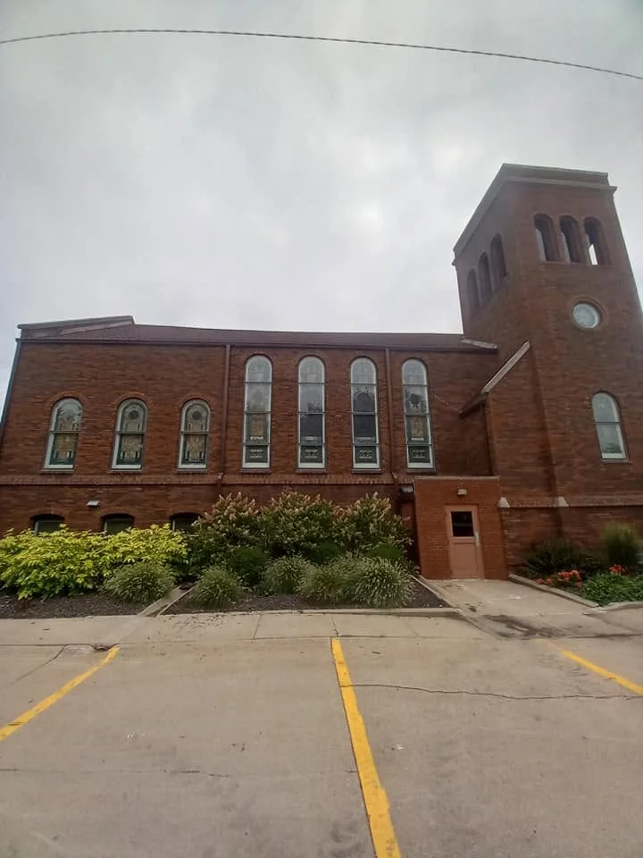 Gutters installed on a large brick church building