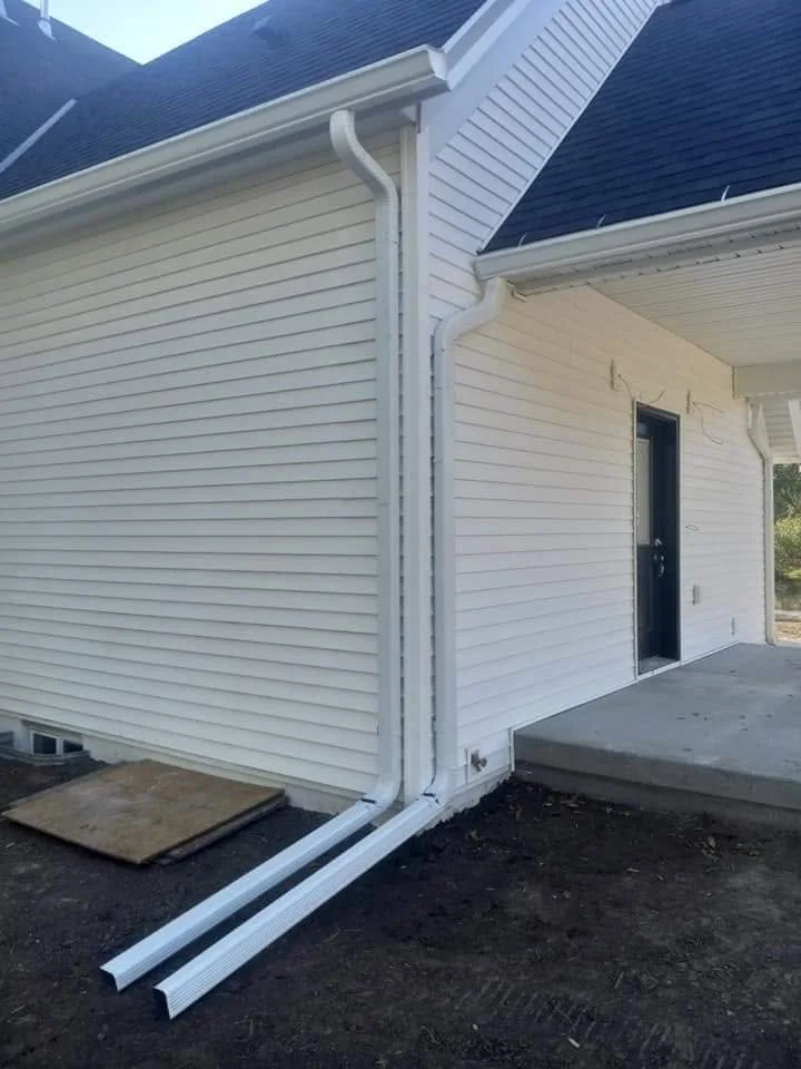 New white gutter corner installed on a home